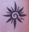 tribal glitter sun tattoo